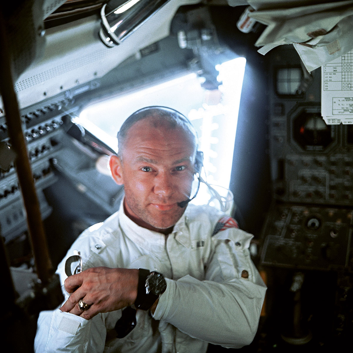 Buzz Aldrin in the cockpit of the Lunar Module, wearing his OMEGA Speedmaster